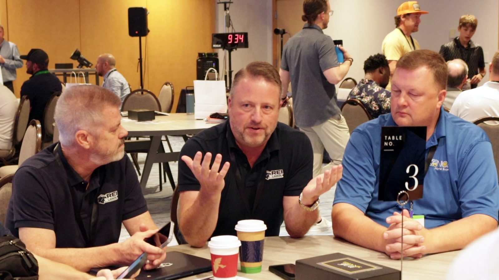 Three members working a problem at a round table